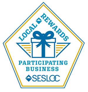 Logo badge for SESLOC Local Rewards Participating Business featuring a gift box with a bow.